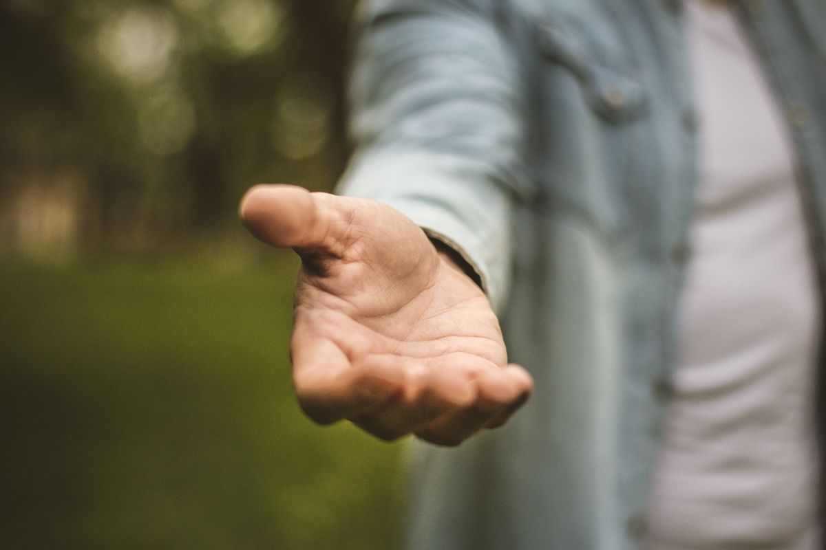 man holding his open hand out